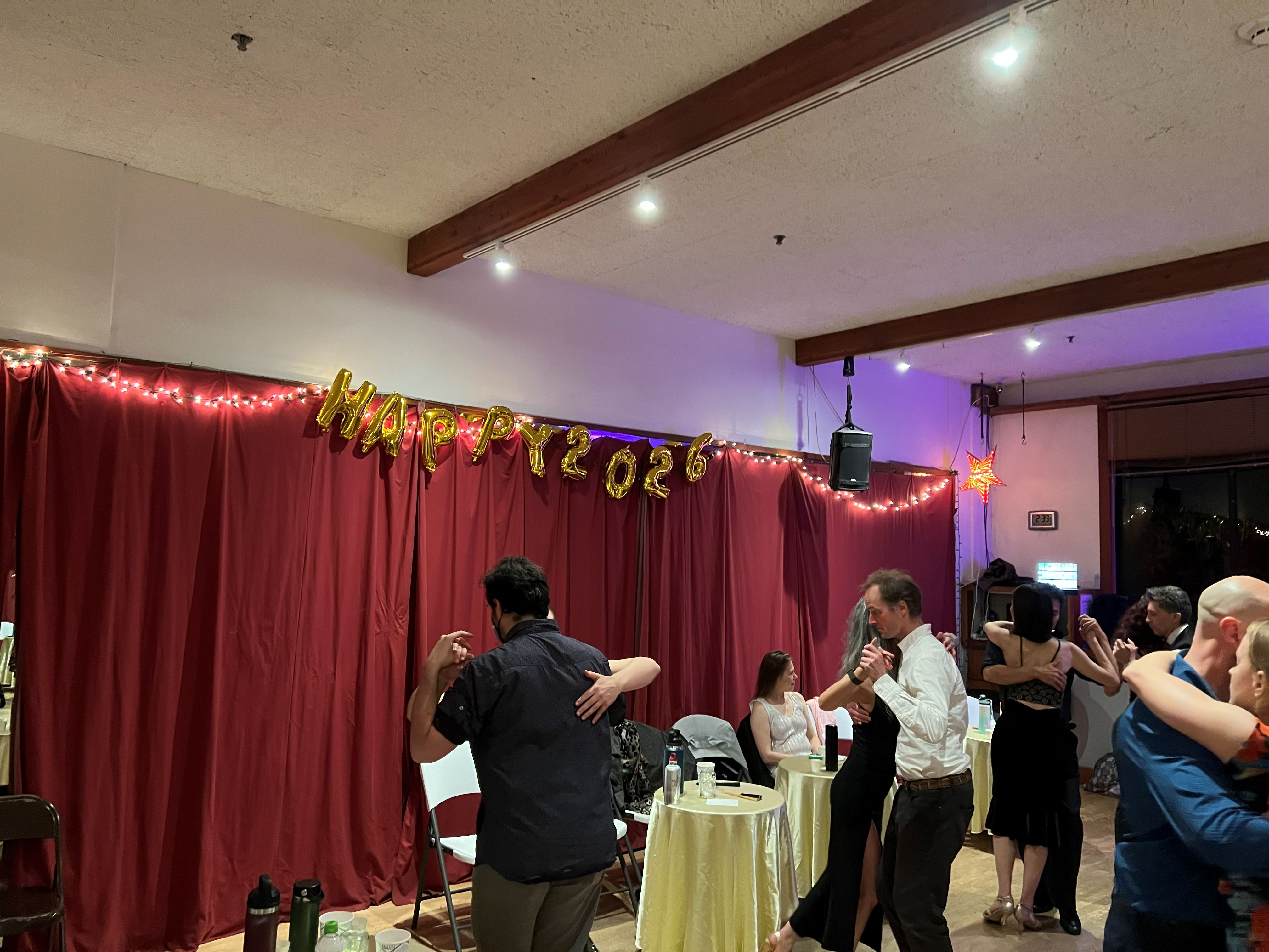 Dancers at All Night Milonga at The Beat in Berkeley with New Year decorations.