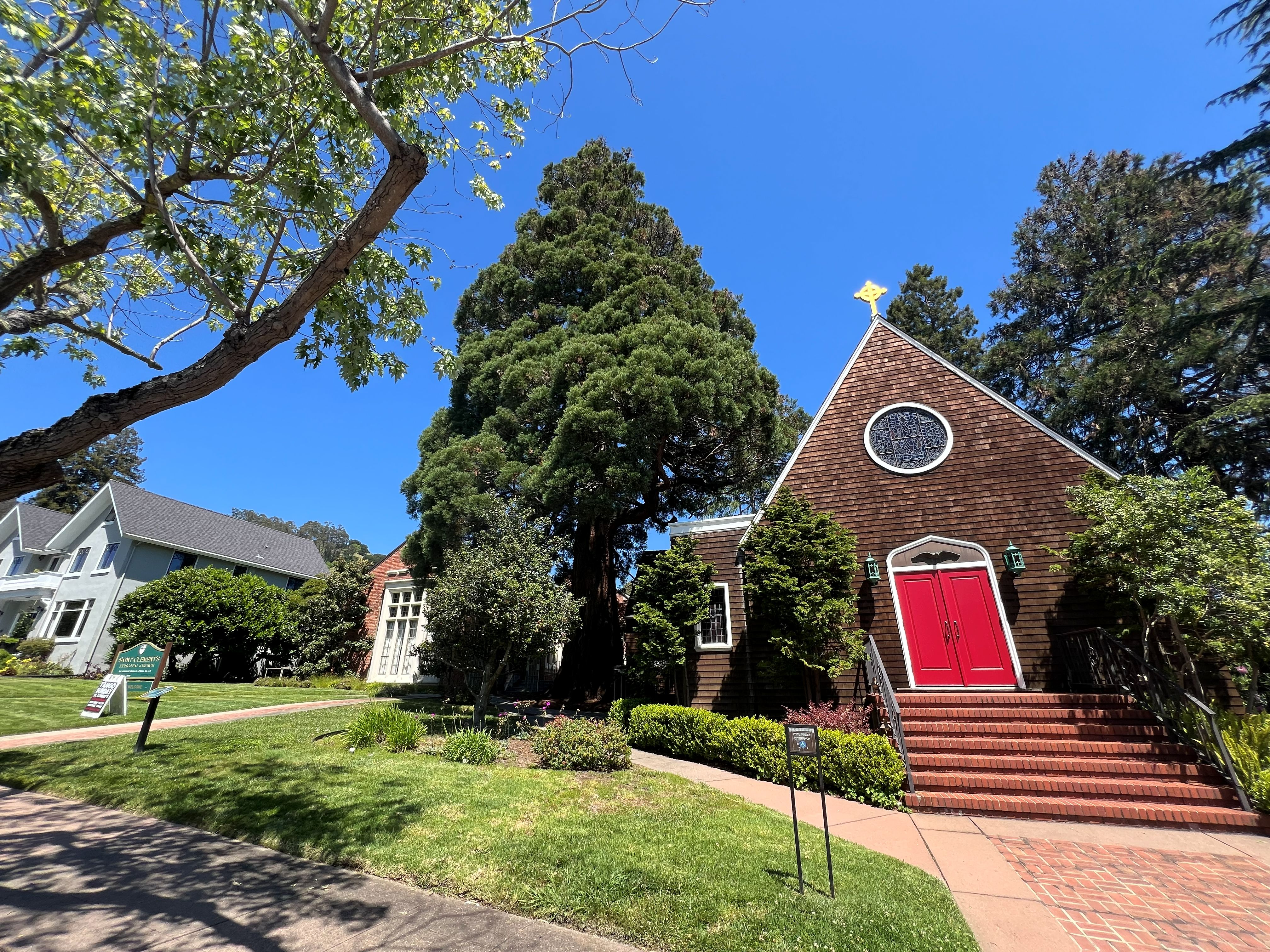 St. Clement's Episcopal Church sign and Tango Sunday sidewalk sign in Berkeley.