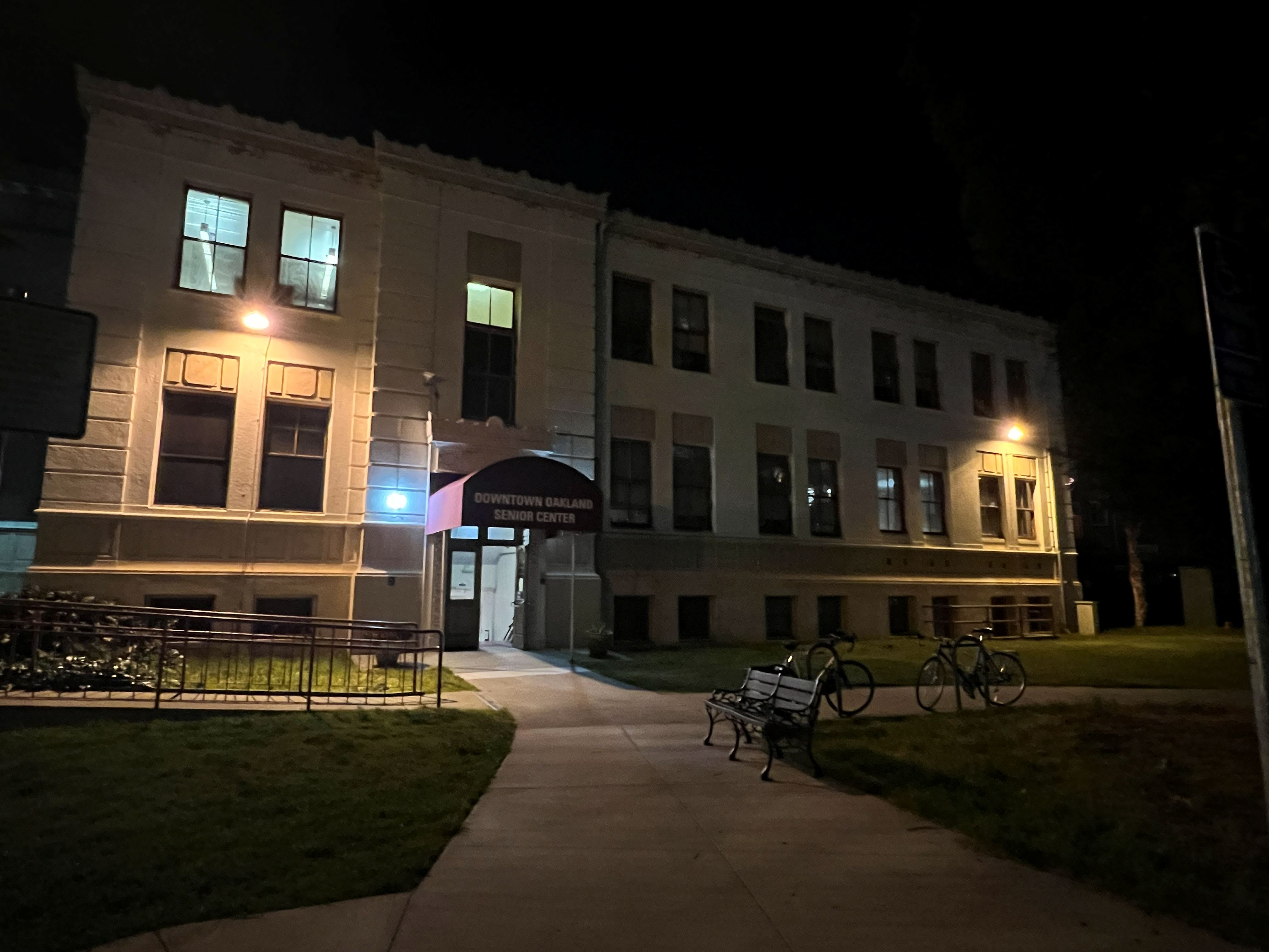 Exterior nighttime view of the Veterans Memorial Building entrance in Oakland.